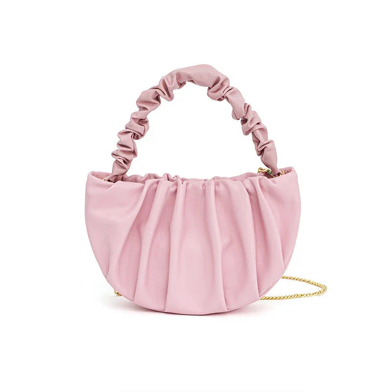 Luxurious sheepskin pleated crossbody bag in various colours, featuring a chic and contemporary design perfect for any occasion.