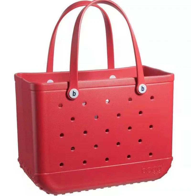 Premium waterproof beach tote bag in various vibrant colours, featuring spacious main compartment and multiple pockets for organised storage