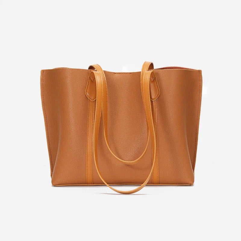 Premium cowhide leather shoulder bag with multiple compartments and adjustable strap for versatile everyday use