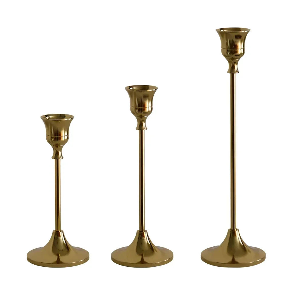 Elegant brass gold candlestick holder set with varying heights, perfect for enhancing the ambiance of any room in the home.