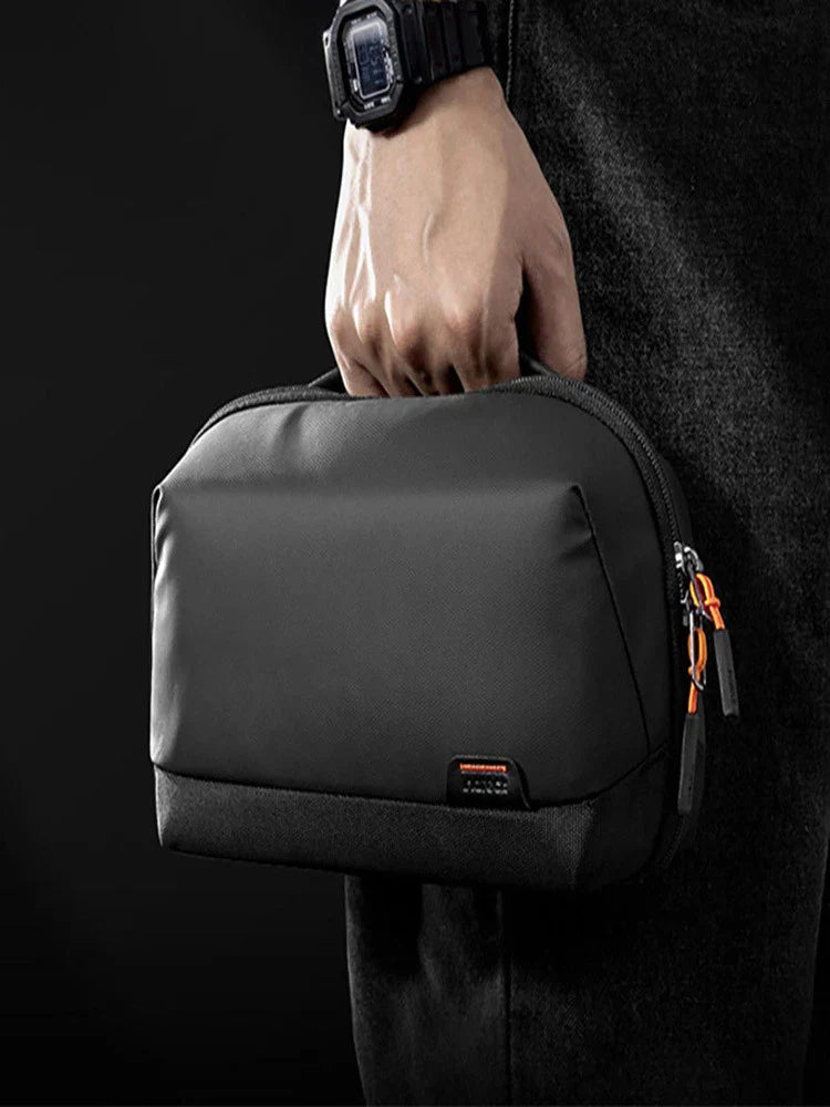 A stylish and waterproof travel organiser bag with cable storage compartment, perfect for keeping your tech essentials organised and protected on the go.