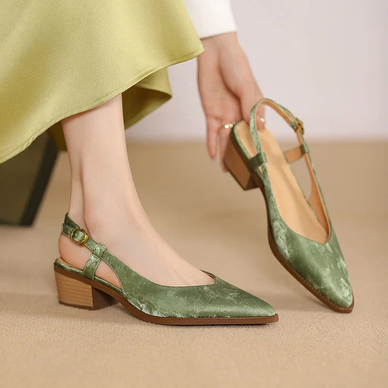 Elegant slingback leather pumps with a stylish mule design, secure buckle closure, and 4cm square heel
