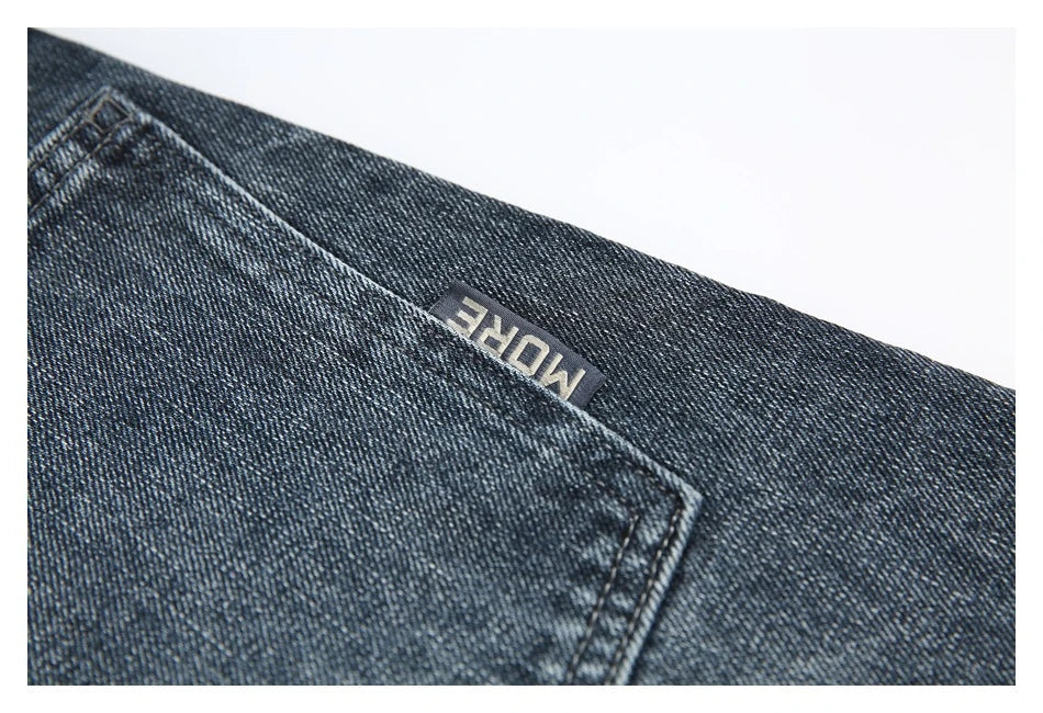 A pair of stylish retro-inspired Japanese jeans in black and grey, featuring a mid-rise waist and straight leg silhouette for a flattering, comfortable fit.