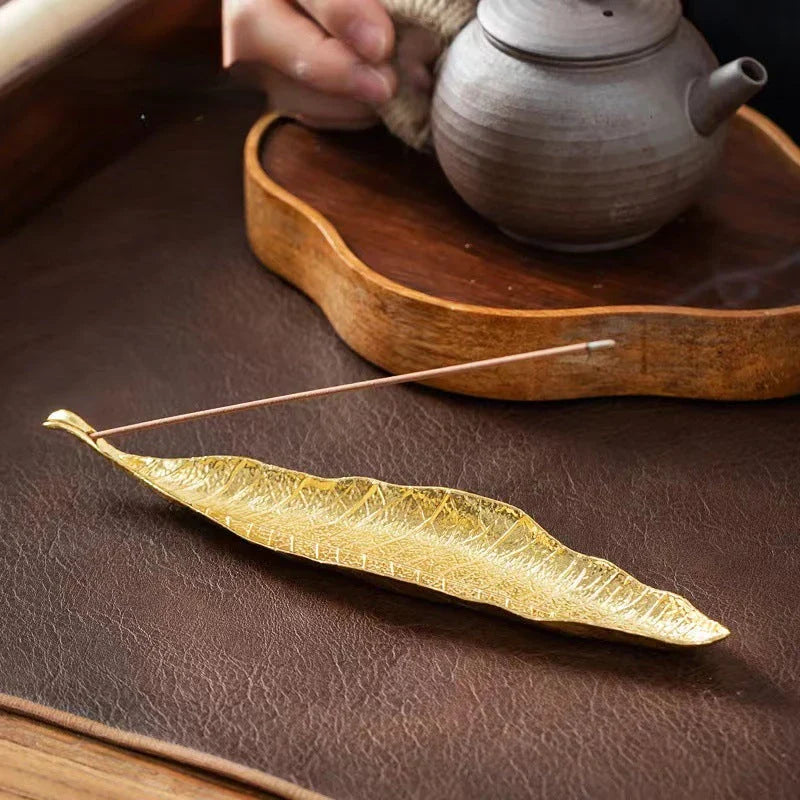 Elegantly crafted copper alloy incense holder with Bodhi leaf design, perfect for meditation and home decor