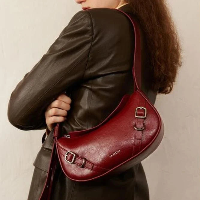Elegant black shoulder and crossbody baguette bag made with premium split leather and synthetic lining