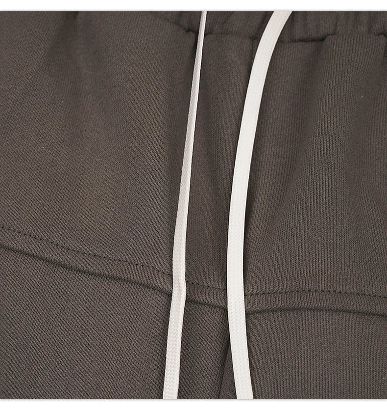 Premium loose-fit sports shorts with eye-catching printed patterns in black, khaki, and dark grey colours