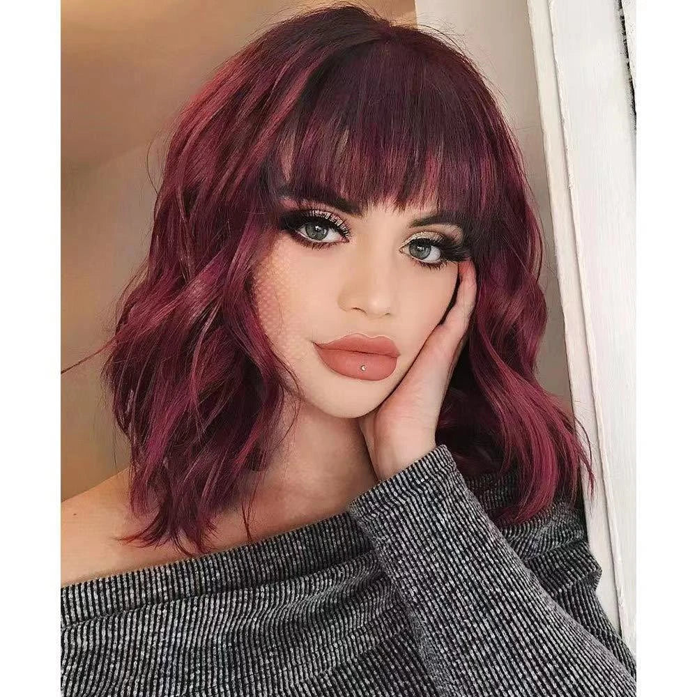 A premium curly wig with natural-looking waves and customisable air bangs, crafted with high-quality artificial hair fibres for a versatile and long-lasting style.
