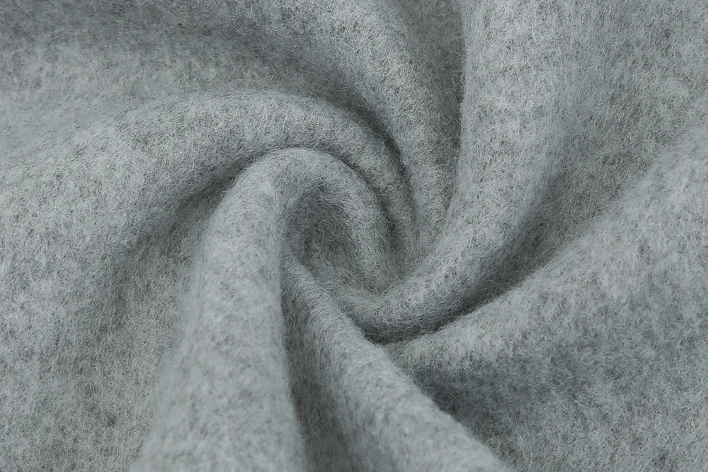 Premium British woollen coat with stand collar, featuring a sleek, slim-fit silhouette and subtle stitching details