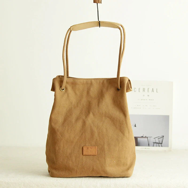 Premium canvas lattice shoulder bag in various colours, featuring a spacious design with secure zipper closure and adjustable strap for comfortable everyday carry