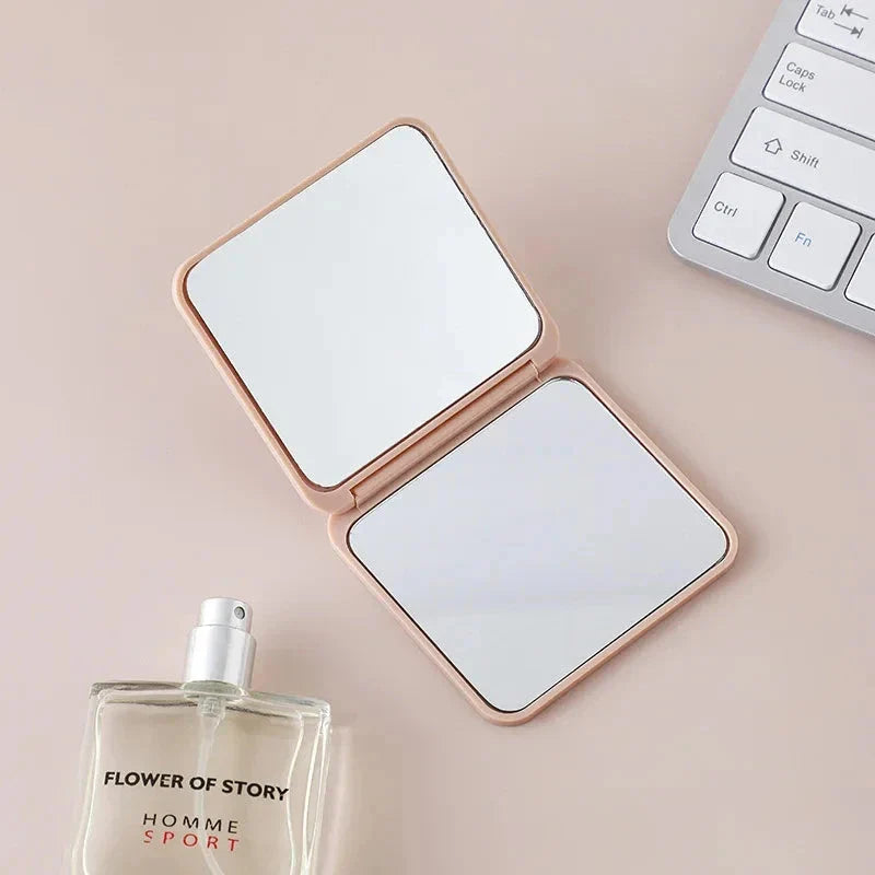 Portable Folding Double-Sided Makeup Mirror in Blue, Pink, Black, and Silver Colours