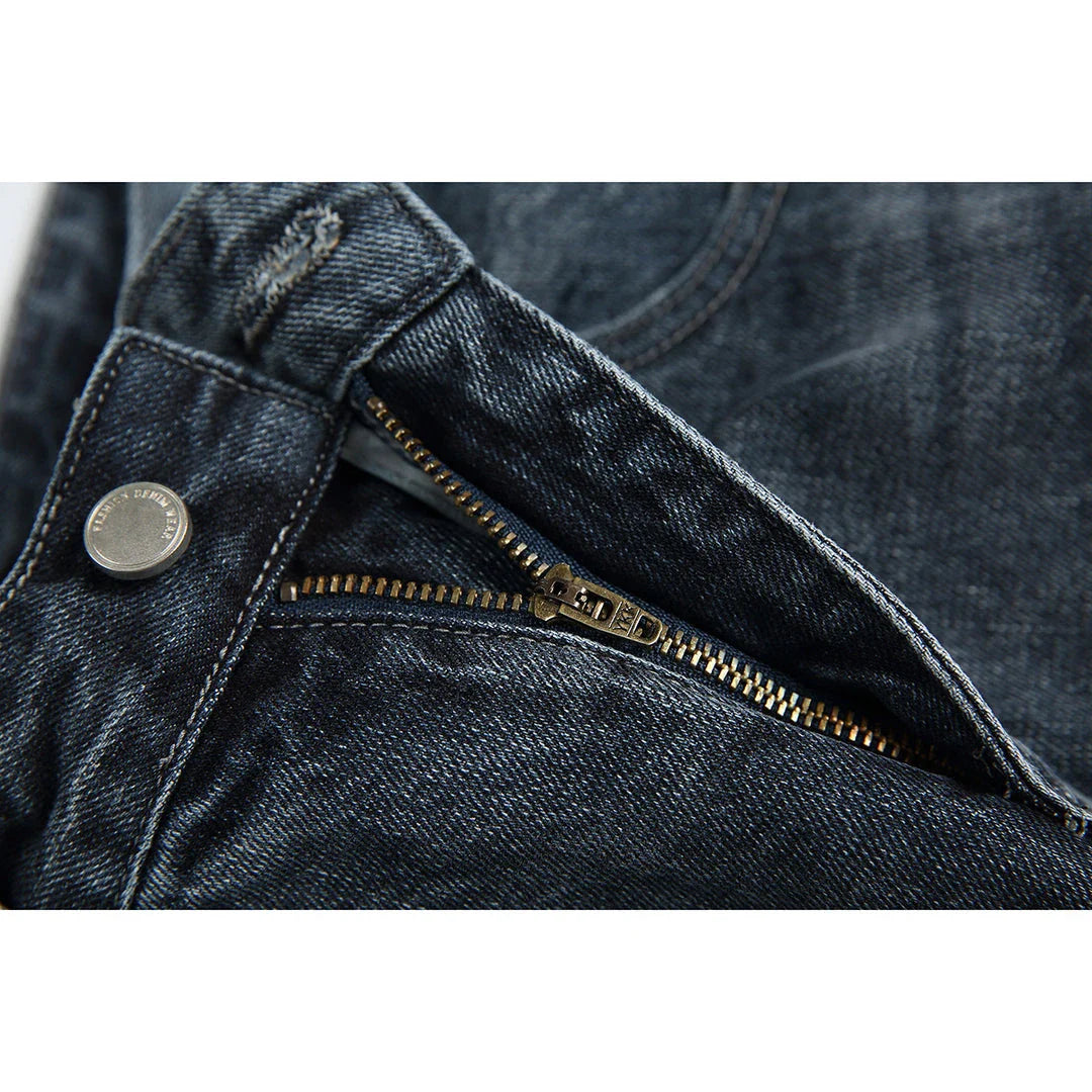 A pair of stylish retro-inspired Japanese jeans in black and grey, featuring a mid-rise waist and straight leg silhouette for a flattering, comfortable fit.