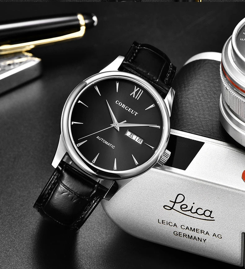 A sophisticated automatic mechanical watch with a gold/white or gold/black face, stainless steel case, and genuine leather strap