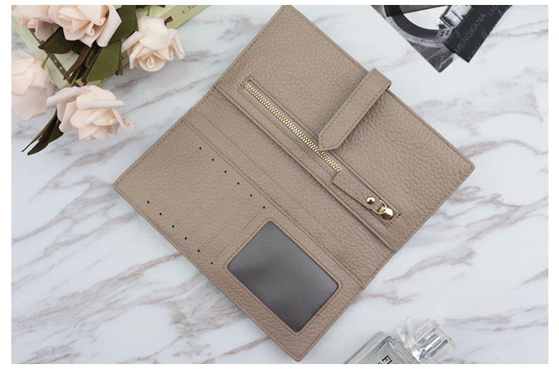 A stylish and practical long wallet made from premium leather, featuring a convenient drawstring closure to keep your essentials organised and secure.