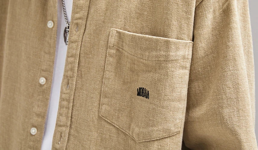 A relaxed, loose-fitting men's shirt in a retro-inspired design, crafted from premium cotton for exceptional comfort and style.