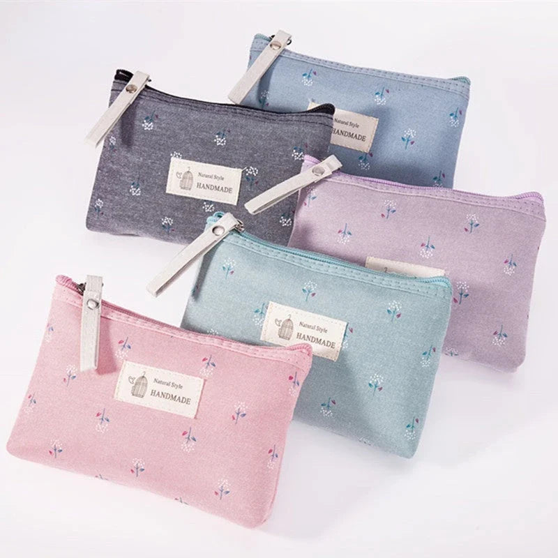 A stylish floral canvas cosmetic bag with a secure zipper closure, perfect for organising and carrying your makeup and toiletries while traveling.