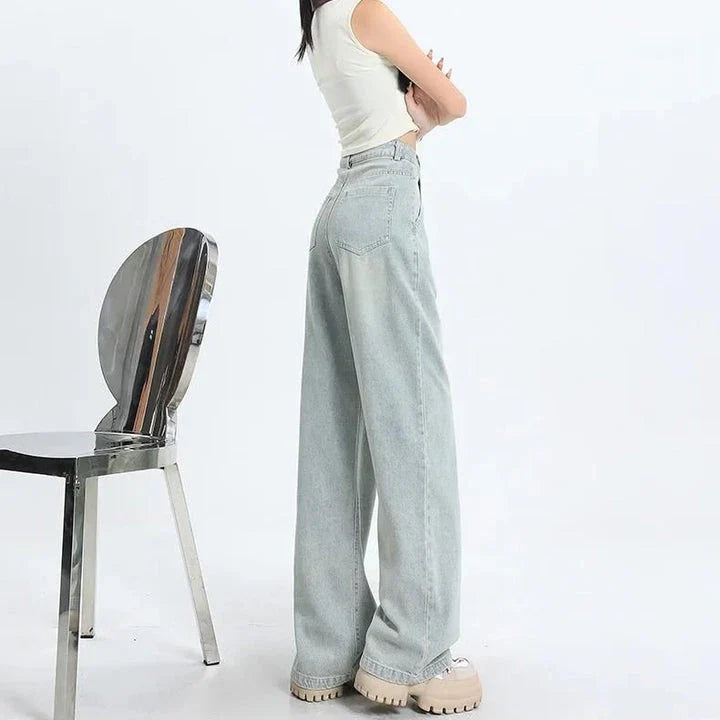 Premium high-waisted vintage straight leg women's jeans in a light wash finish with decorative details