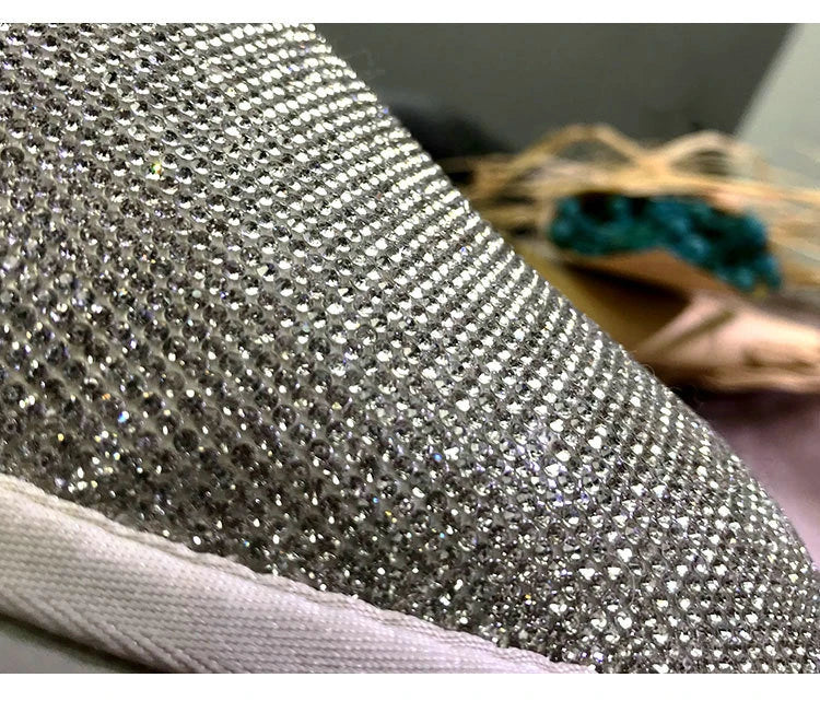 Premium rhinestone-embellished ankle boots for women, featuring a shimmering upper and durable rubber sole for winter wear