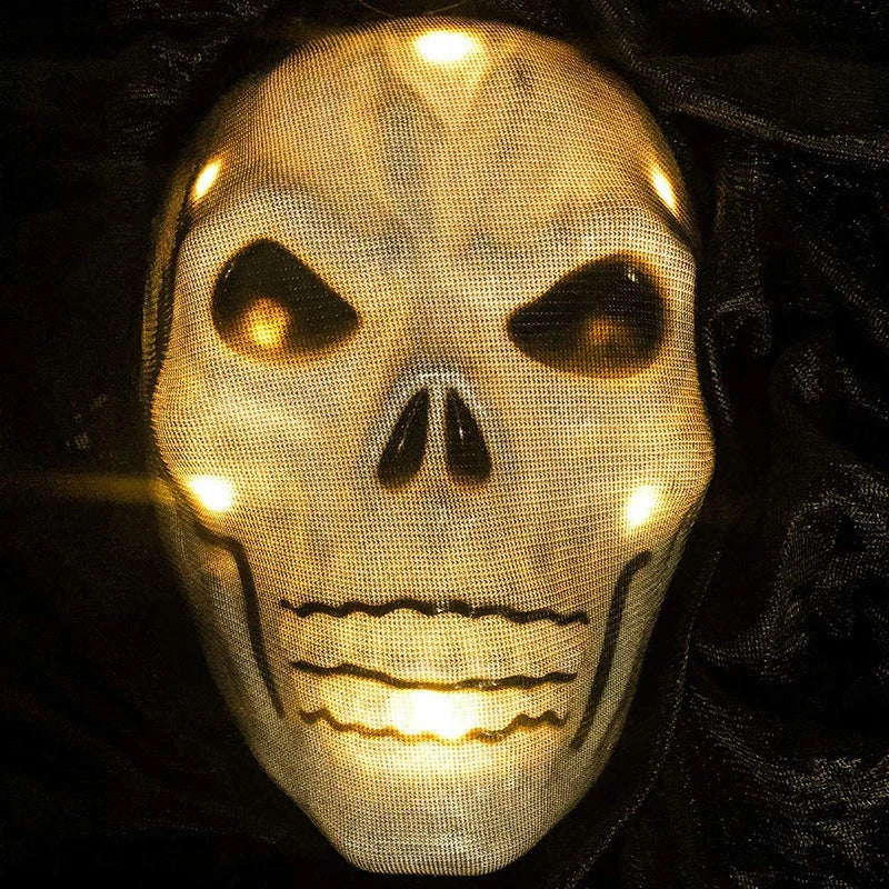 Voice-activated Halloween decoration with ghost-shaped design, lighting, and sound effects