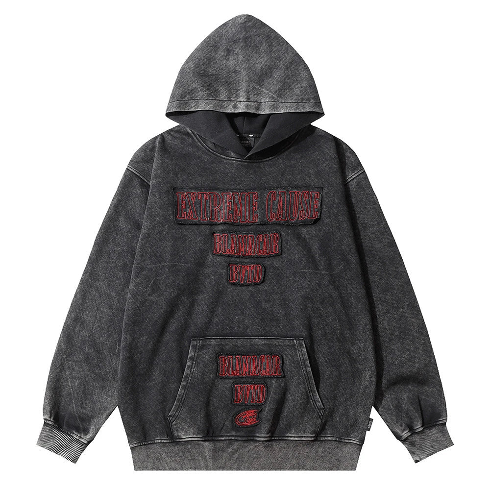 Embroidered cotton hoodie with a letter patch design, available in brown, grey, and black colours and sizes S to XL