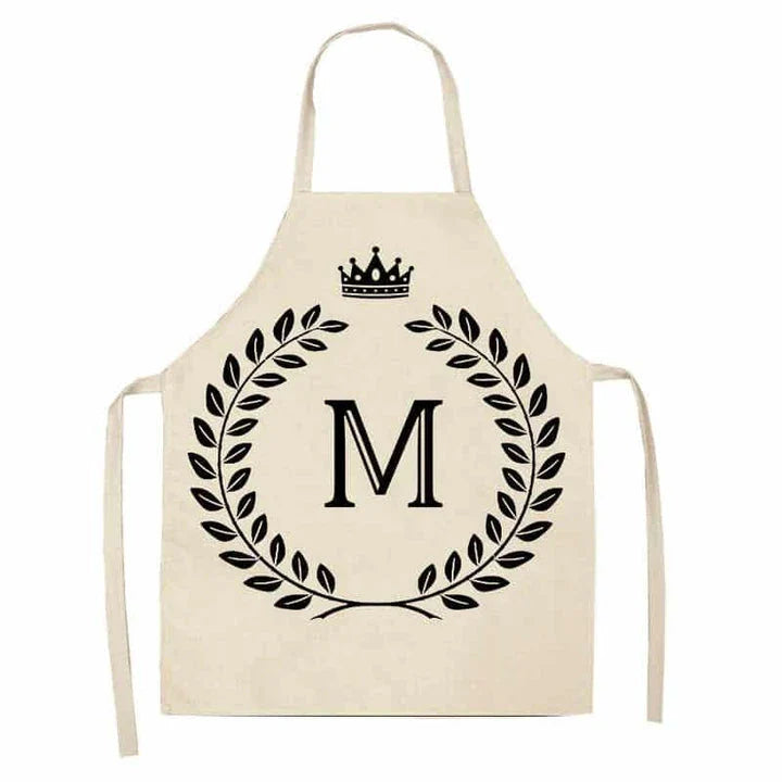 A high-quality kitchen apron featuring a charming crown and letter print design in a premium cotton and linen blend fabric.