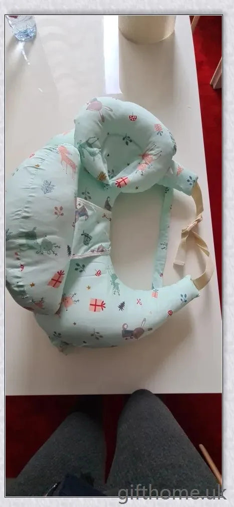 Premium breastfeeding nursing pillow with adjustable buckle, soft cotton fabric, and extra cushioning to support baby's head and prevent reflux.