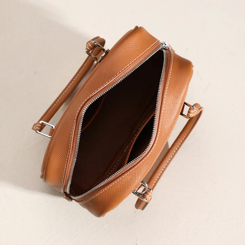 Elegant leather mini shoulder bag in a variety of colours, featuring a compact and versatile design for the stylish British woman.