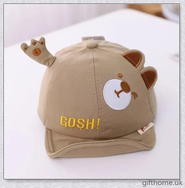 Adorable cartoon baby cap in various colours, made of breathable linen-blend fabric for comfort and sun protection