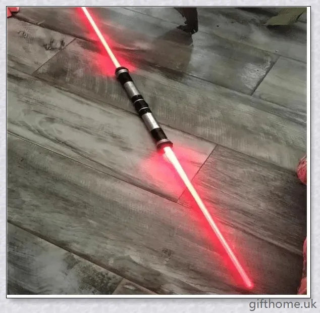 Premium dual-bladed lightsaber with sleek silver hilt, vibrant light modes, and sound effects for authentic Star Wars gameplay