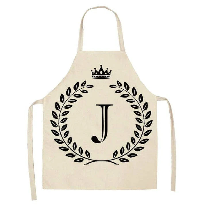 A high-quality kitchen apron featuring a charming crown and letter print design in a premium cotton and linen blend fabric.