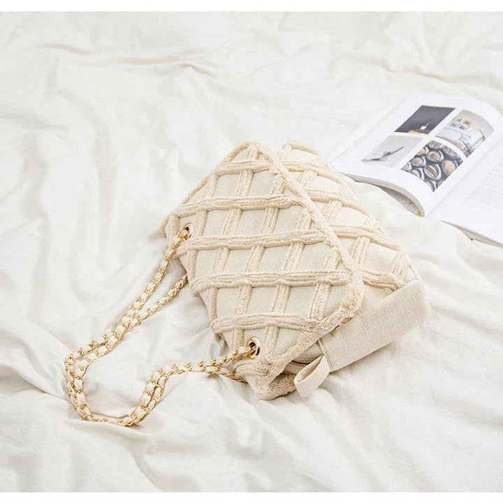 A stylish, retro-inspired shoulder bag with a minimalist rhombus pattern design, perfect for the modern, fashion-conscious woman in the UK.