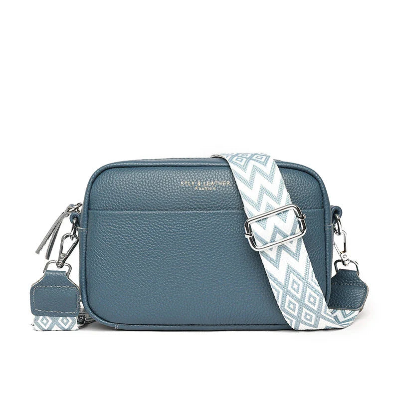Stylish leather crossbody bag with embroidered strap in various colours