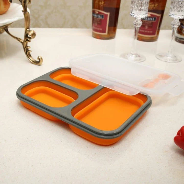 Collapsible silicone lunch box in orange colour, featuring a leakproof design and 1100ml capacity for on-the-go meals.