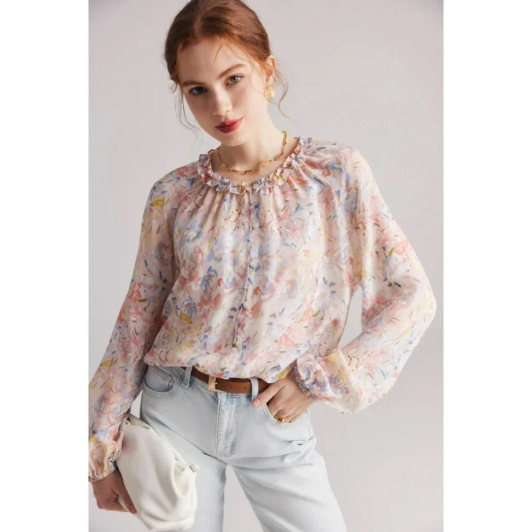 Floral silk blouse with ruffles and round neckline, showcasing the elegant and comfortable design for versatile wear.