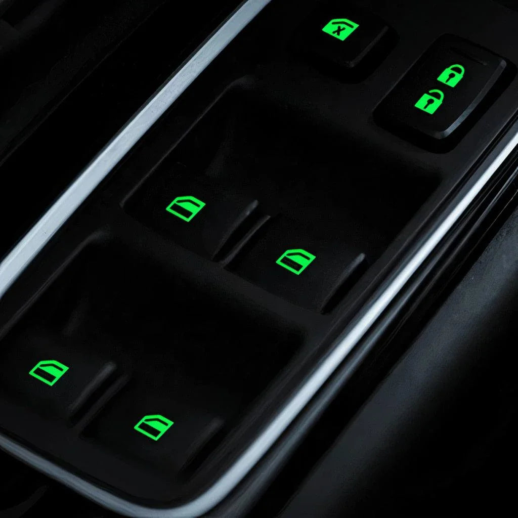 Fluorescent car button stickers emitting a bright green glow for easy visibility in the dark