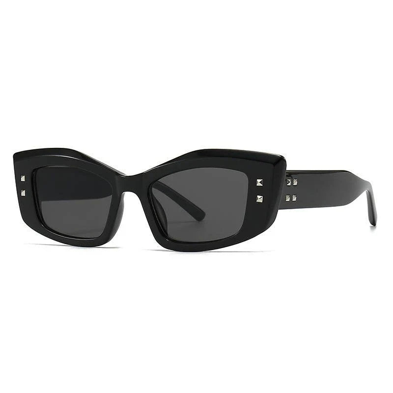 Retro cat eye sunglasses with rivet details, offering a stylish and protective eyewear solution.