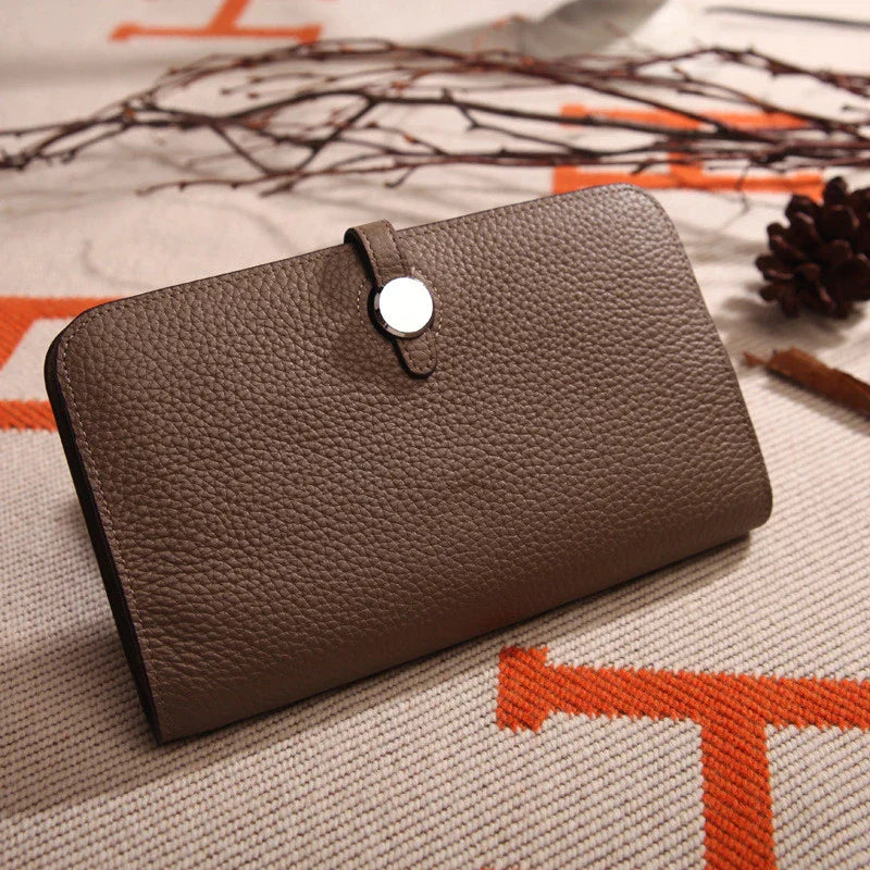 Premium cowhide leather wallet with luxurious lychee pattern design, featuring multiple compartments for secure storage and organisation.