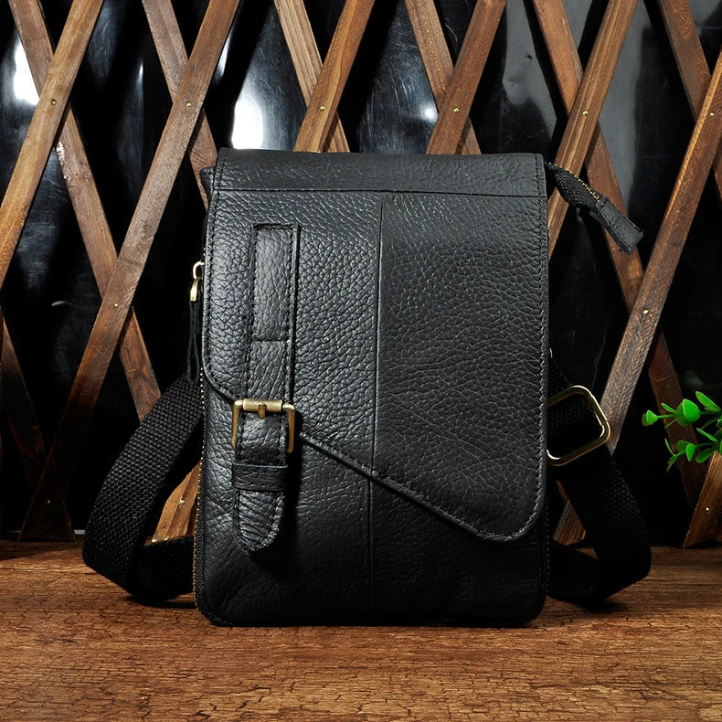 Premium cowhide leather one-shoulder crossbody bag in light grey colour with adjustable strap and zipper pocket