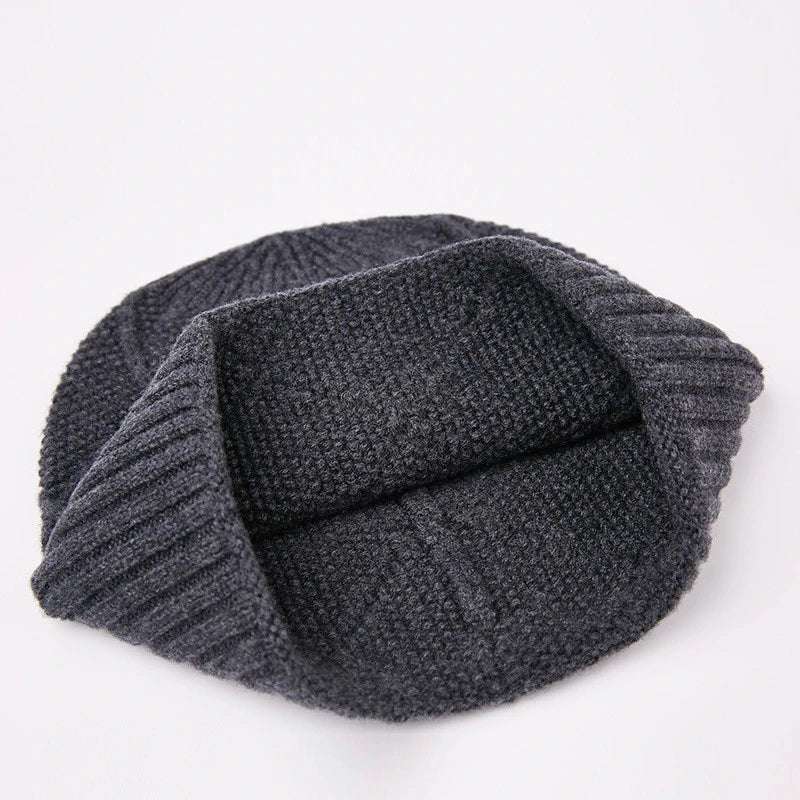 Premium knitted hat in various colours with a dome-shaped design, concave stripe pattern, and adjustable fit for warm outdoor fashion
