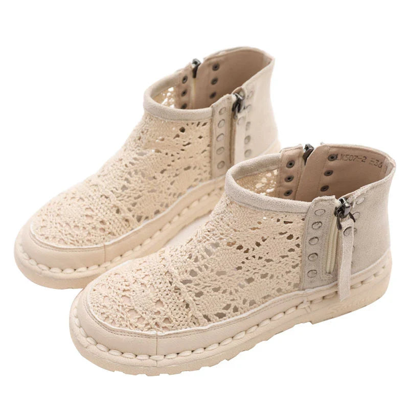 Stylish flat-soled women's Martin boots in grey and beige colours, featuring a durable denim upper and sturdy rubber sole for all-day comfort and support.