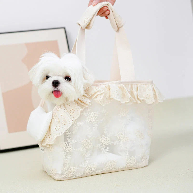 Stylish and comfortable pet carrier bag for small dogs in a floral lace design, providing breathable and cushioned support for your furry friend