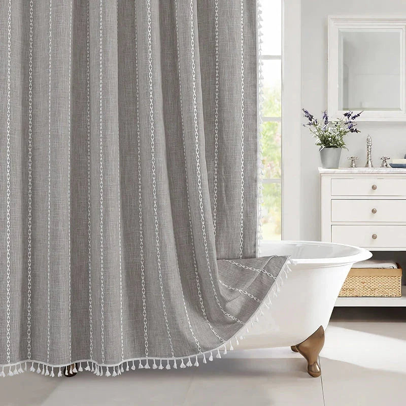 Premium bohemian tassel shower curtain with unique stitching design, waterproof coating, and durable linen blend material for a relaxing bathroom oasis