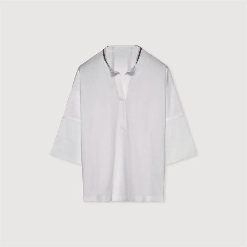 Stylish bead-embellished split-hem t-shirt in white, designed for the modern British woman with a touch of elegance and comfort.