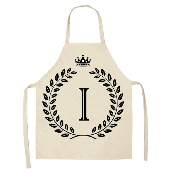 A high-quality kitchen apron featuring a charming crown and letter print design in a premium cotton and linen blend fabric.