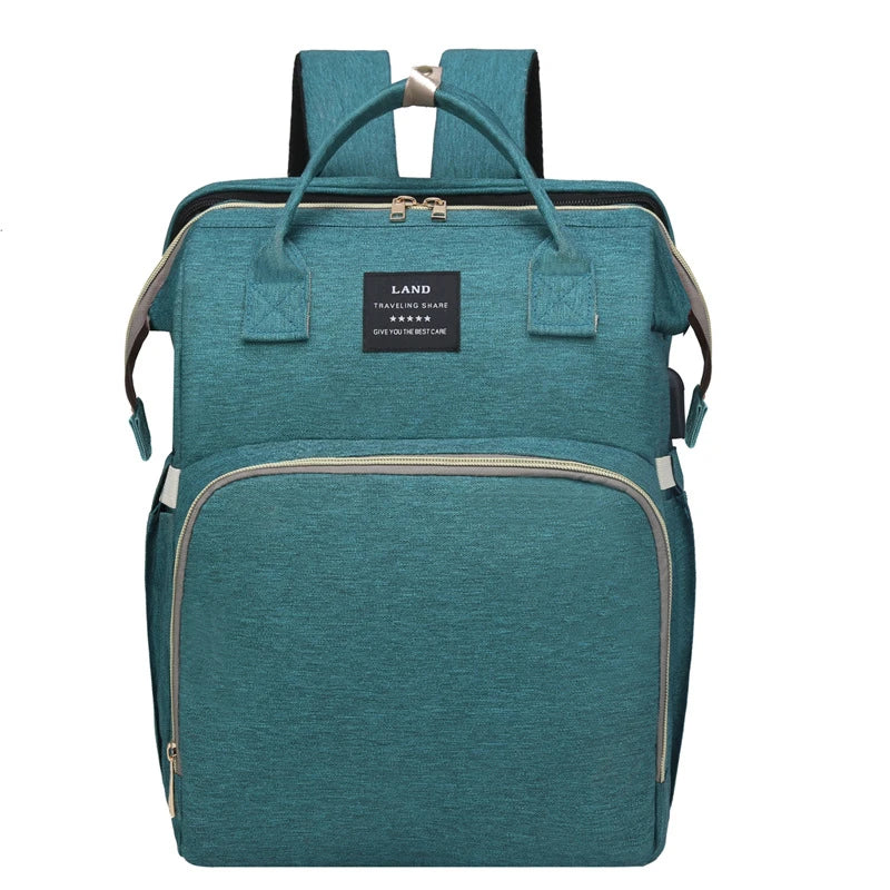 Multifunctional maternity diaper backpack with removable mosquito net, foldable crib, and water-resistant design for convenient family travel