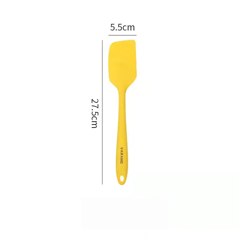 A set of two high-quality silicone spatulas in brown and yellow colours, designed for versatile cooking and baking tasks.