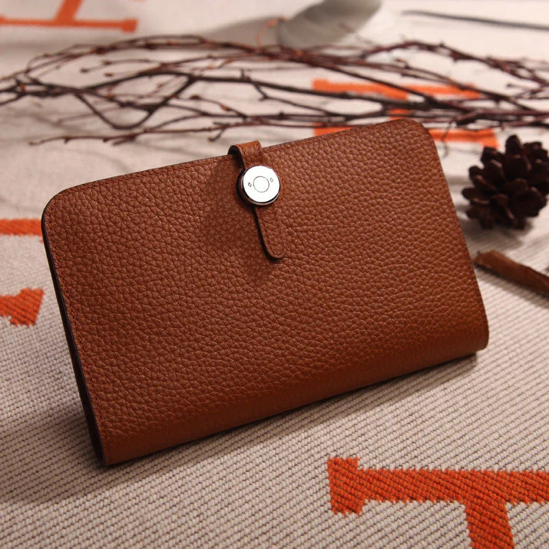 Premium cowhide leather wallet with luxurious lychee pattern design, featuring multiple compartments for secure storage and organisation.