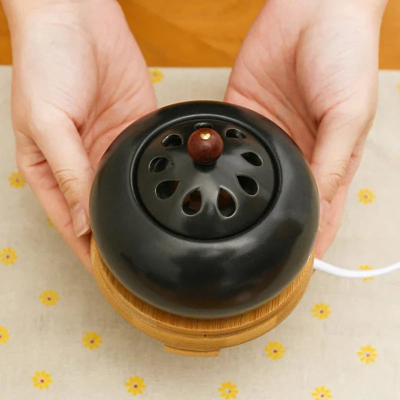 Elegant electric incense burner with adjustable temperature and timer function, perfect for creating a soothing ambiance in your home.