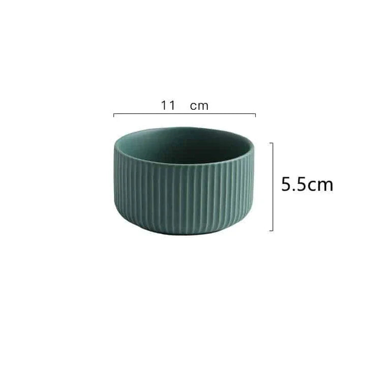 Candy-coloured ribbed ceramic tableware featuring plates, bowls, and other dining accessories in vibrant hues