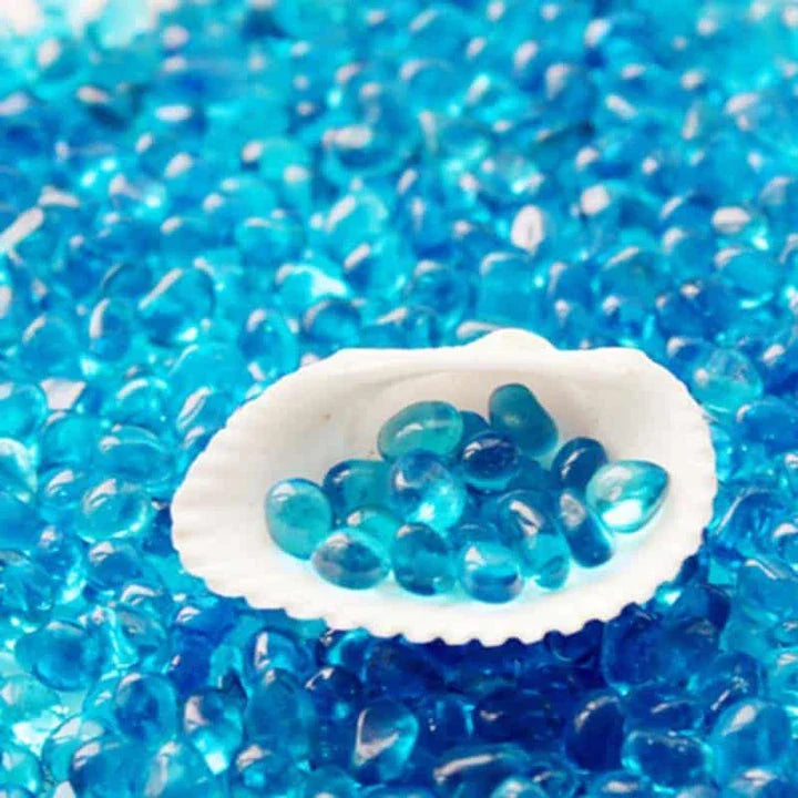 Premium blue aquarium gravel with smooth, rounded pebbles for a safe and comfortable underwater environment