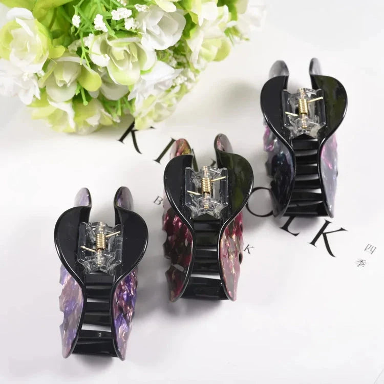 Elegant large floral acrylic hair clips in various colours for a sophisticated look